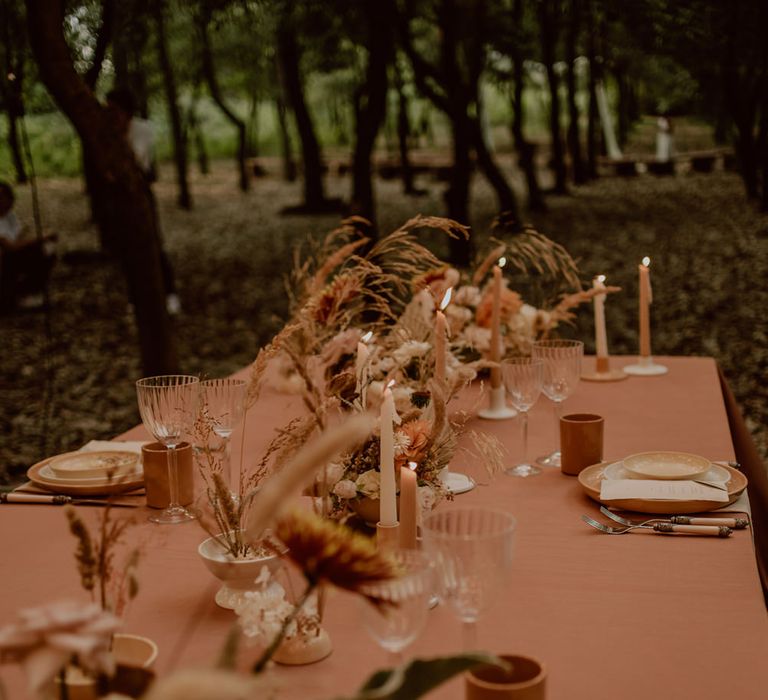 Neutral table decor and flowers for boho elopement in a forest 