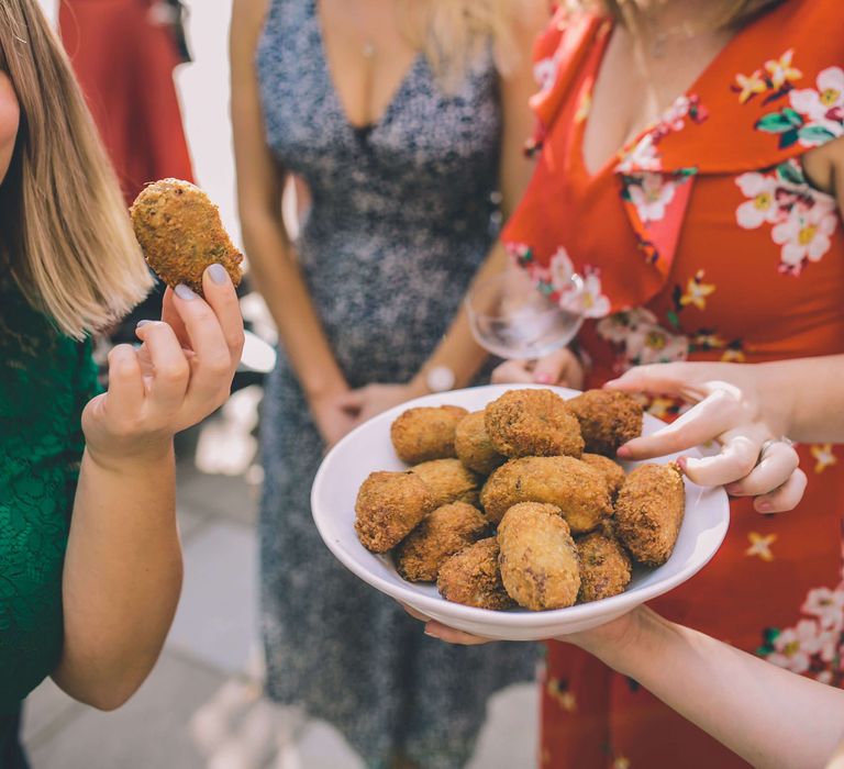 Wedding guests enjoying finger food