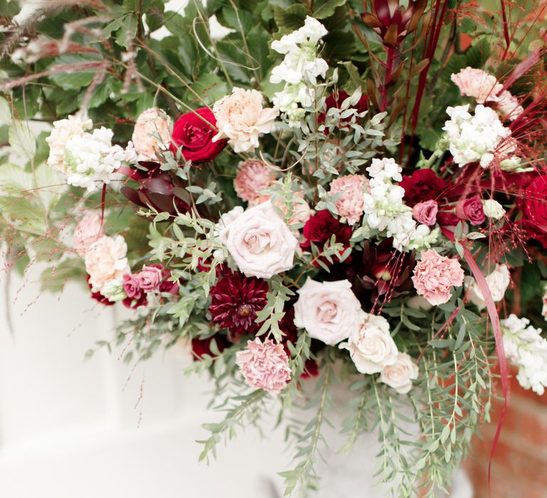 Floral decoration featuring red and white blooms