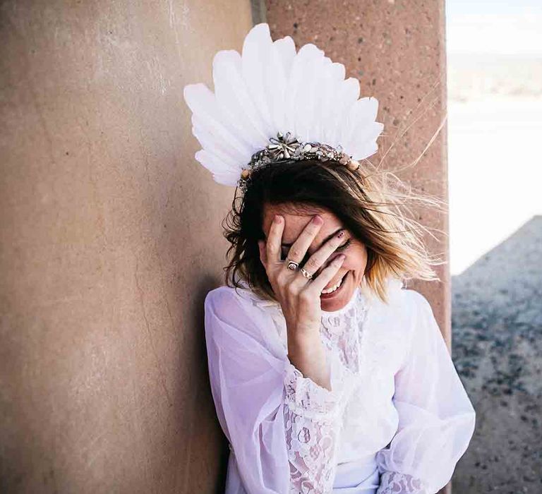 Bride in white feather headpiece