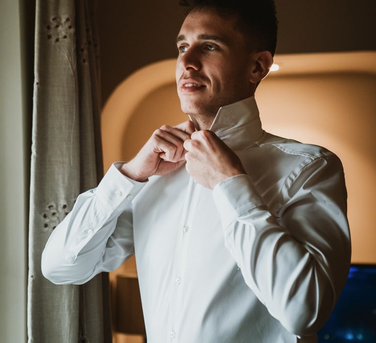 Groom gets ready on the morning of his wedding