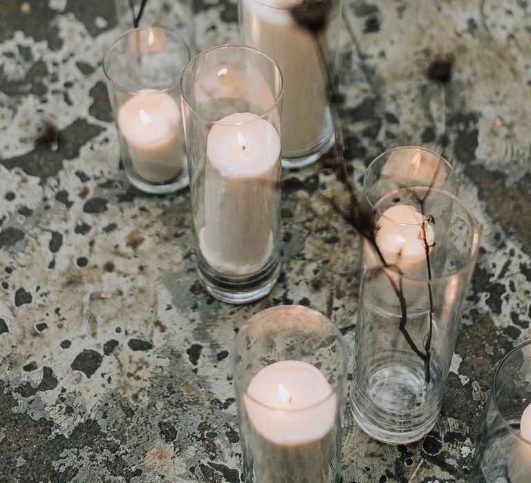 Pillar candle decoration for an industrial all white wedding