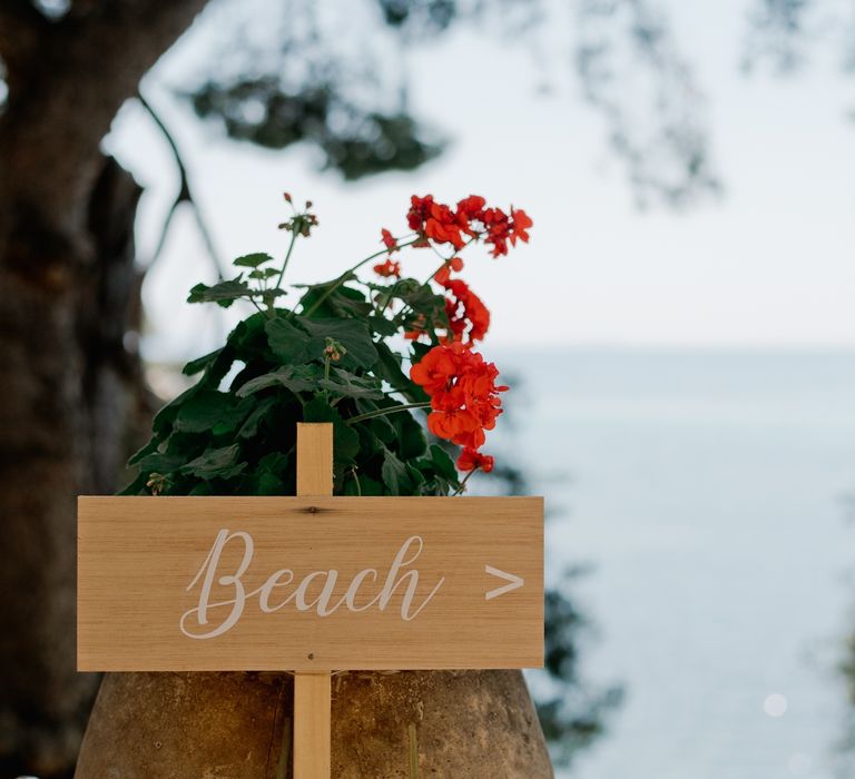 wooden wedding sign to the beach