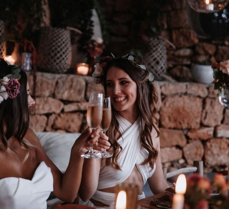 Two brides toasting with champagne