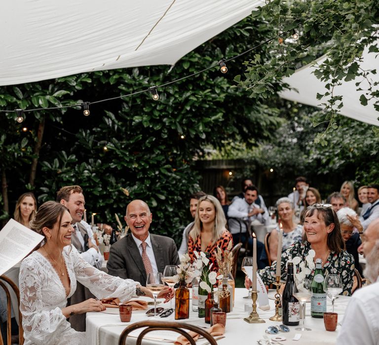 Guests enjoy grooms wedding speeches