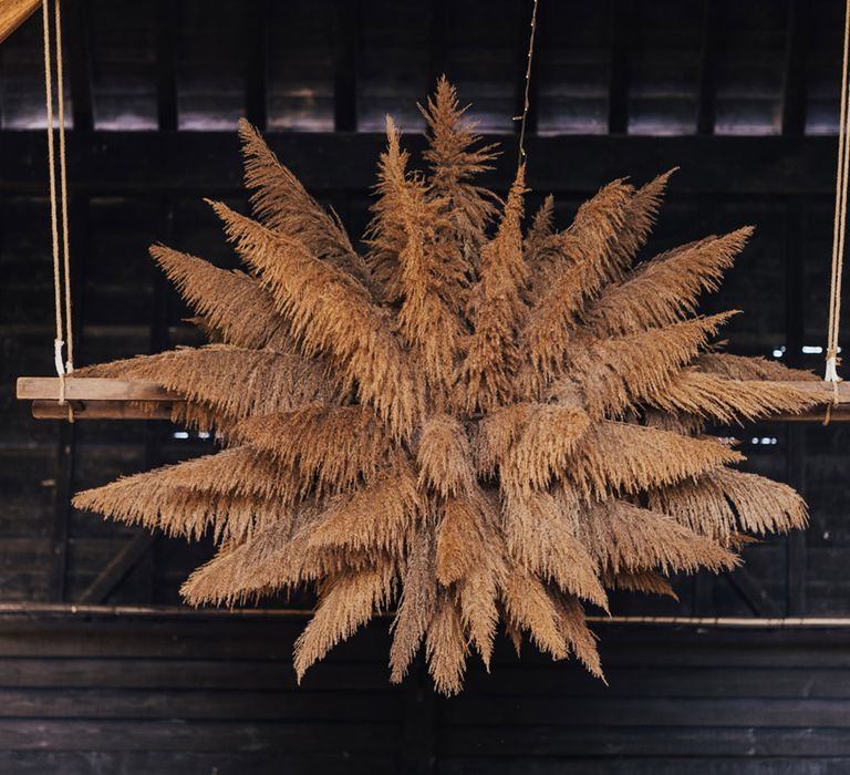 Ceiling pampas arrangements at Boho Barn wedding