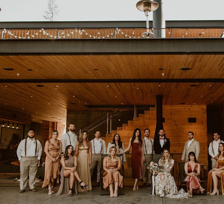 Bride & groom stand with their wedding party