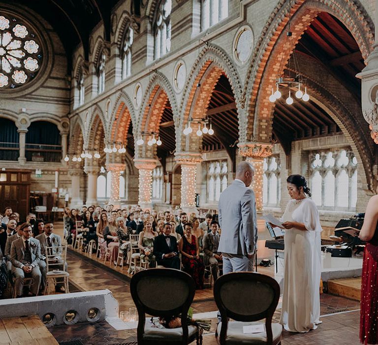 Bride & groom read their wedding vows on their wedding day | Irene Yap Photography