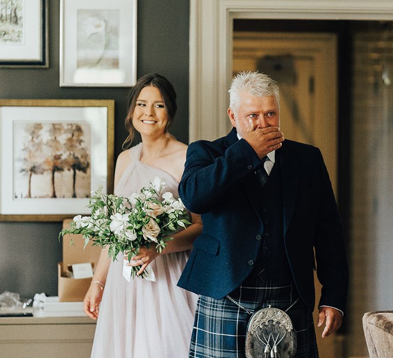 Father of the bride first look in a navy blue tartan kilt and sporran 