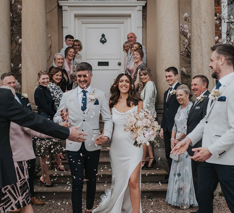 Bride and groom have confetti moment 