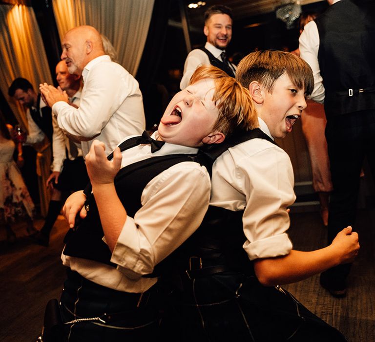 Children in kilts dance during wedding reception 