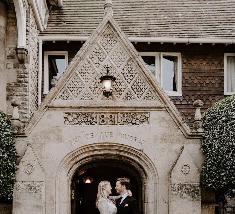 Normanton Church wedding with the bride and groom celebrating together at the entrance 