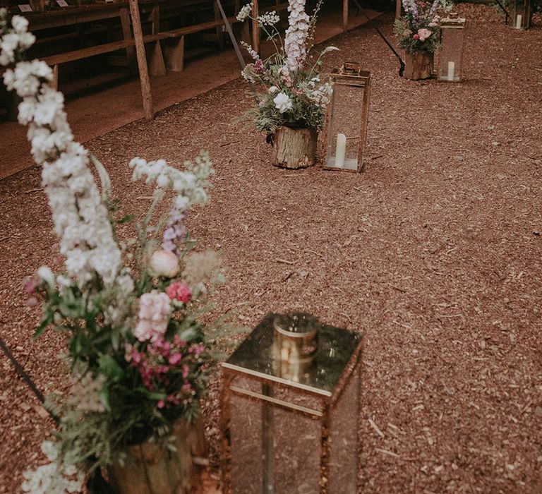 Lila's Wood wedding venue with marquee and long wooden benches for boho outdoor wedding 