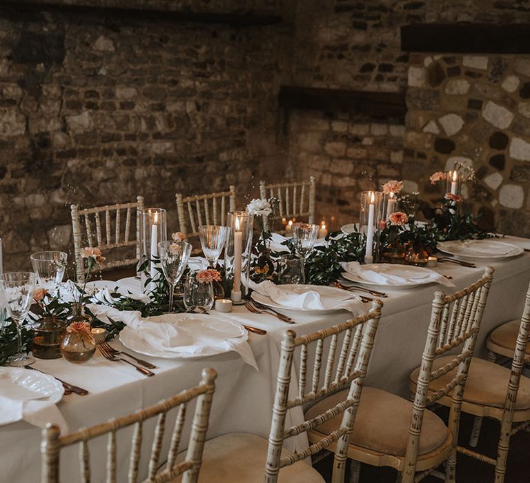 Orange, green and white theme wedding tablescape with floral decorations 