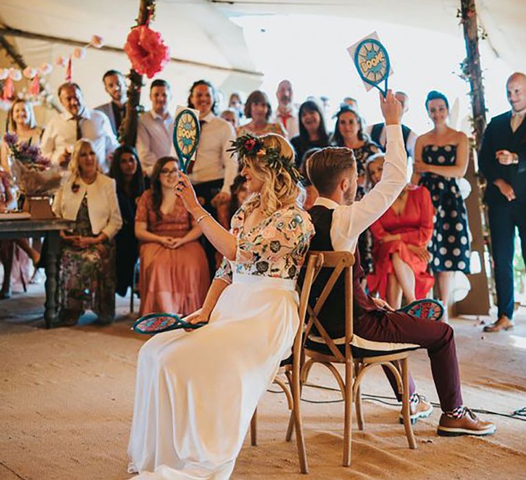 Mr and Mrs quiz with bride and groom during wedding reception 