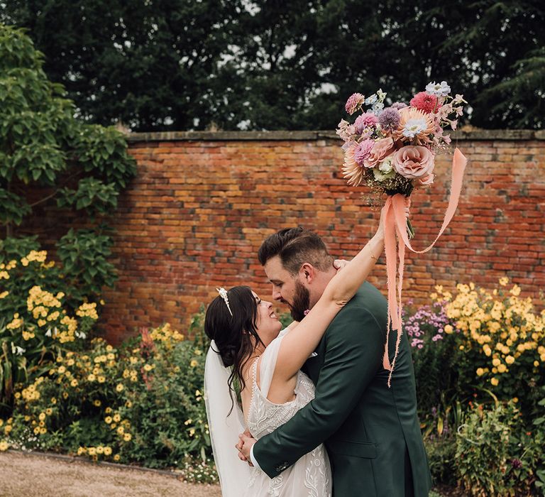 Bride kissing the groom on their wedding day in the West Midlands 