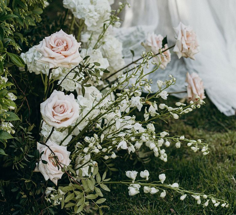 Wedding flower arrangements for traditional wedding with pink and white roses 