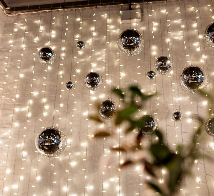 Fairy lights and disco ball wedding decor