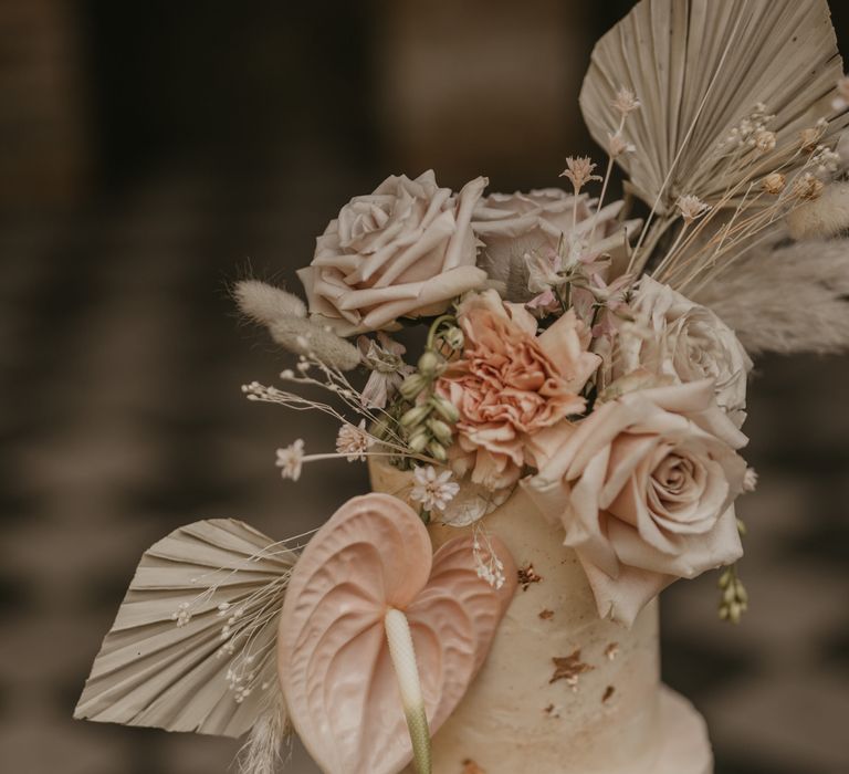 Anthurium cake decor on buttercream wedding cake 