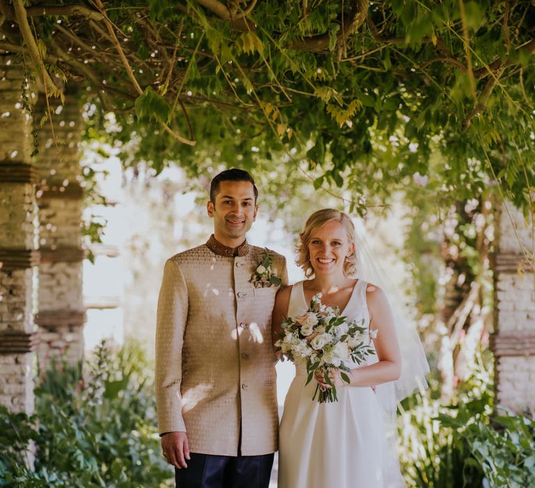 Bride and groom portrait in the garden 