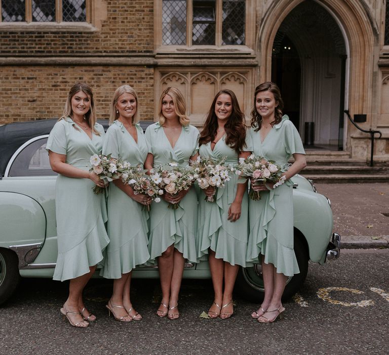 Pastel mint bridesmaid dresses with matching car