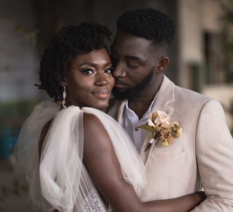 Black bridal makeup with shimmer cheeks and grey eyeshadow 