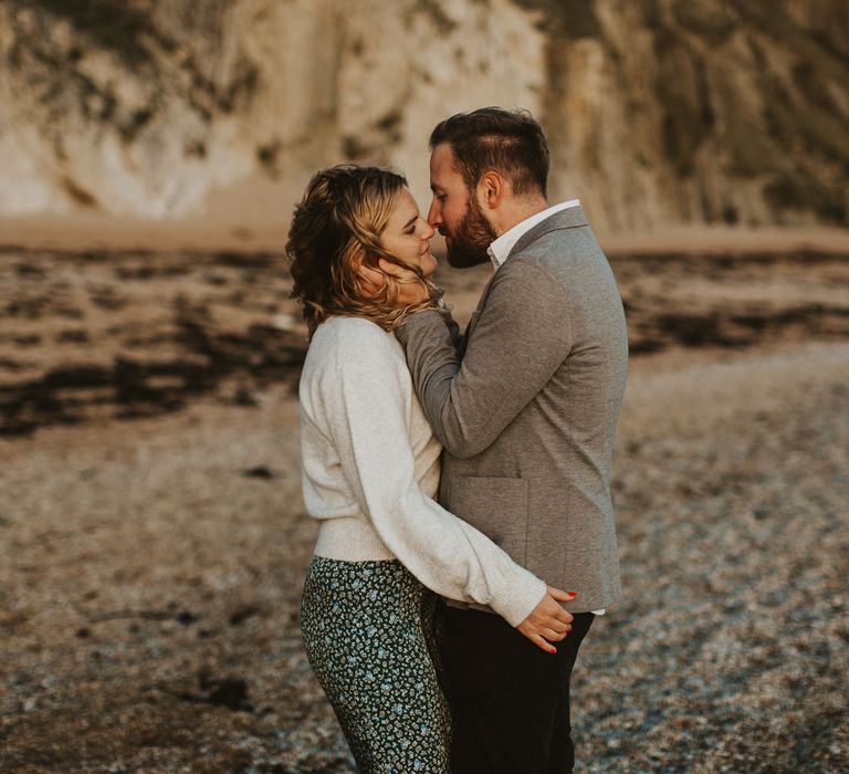 Engaged couple on beach photoshoot