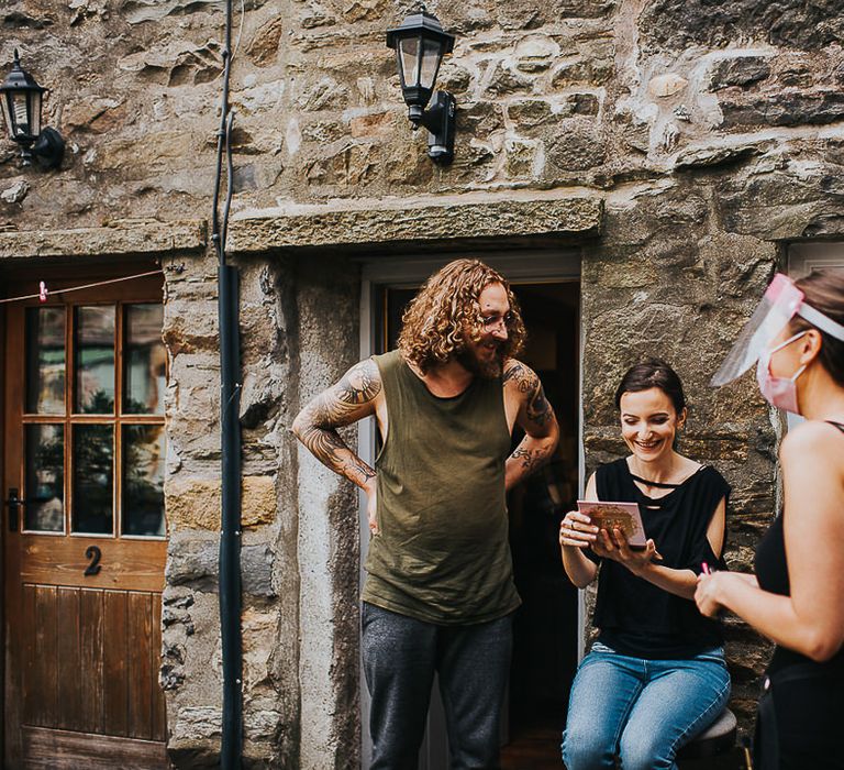 Groom sees bride after having makeup applied on the morning of their wedding