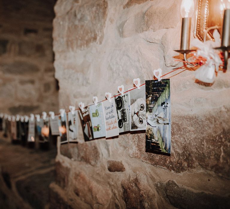 Postcards with heart shaped pegs at rural German wedding