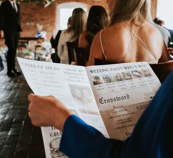 Wedding newspaper order of service with wedding party details photographed by Rosie Kelly Photography