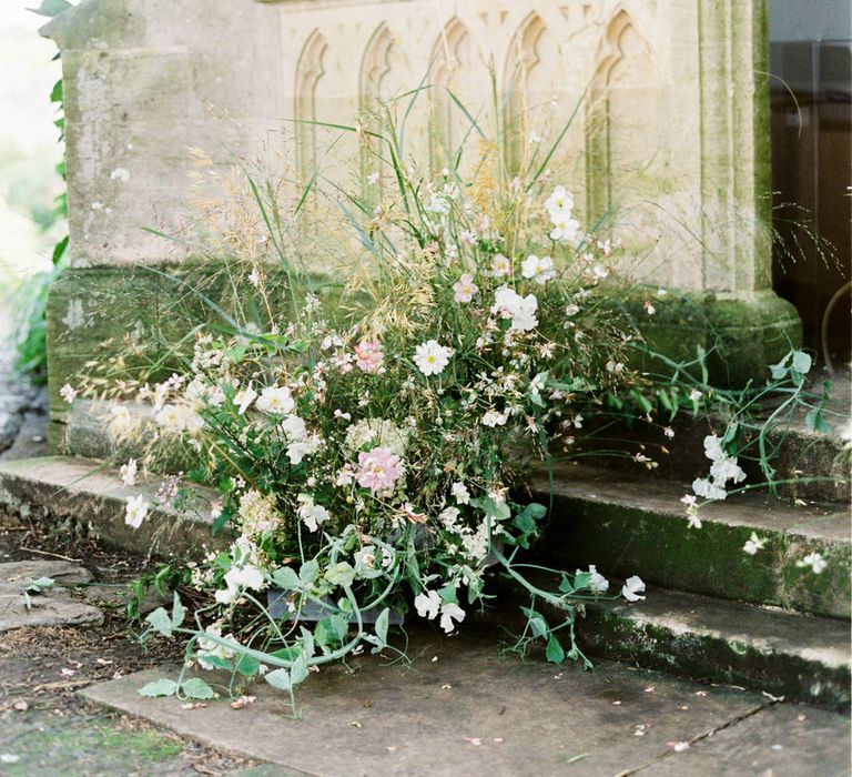 Romantic white wildflowers and grass decorations for English garden party wedding