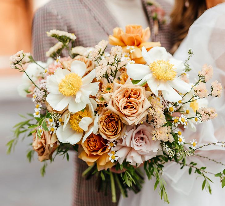 Citrus orange and yellow wedding bouquet with roses and carnations by Bud Flora