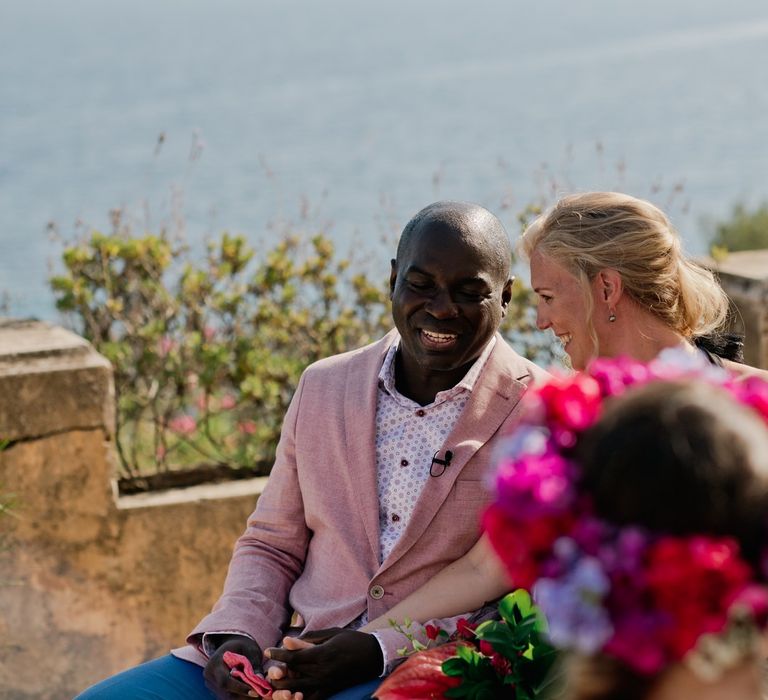 Groom in pink linen jacket for French wedding