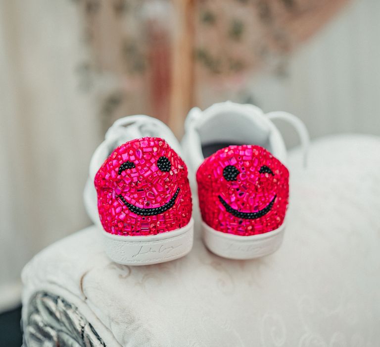 Bridal trainers with pink sparkle embellishment to the back and smiley face