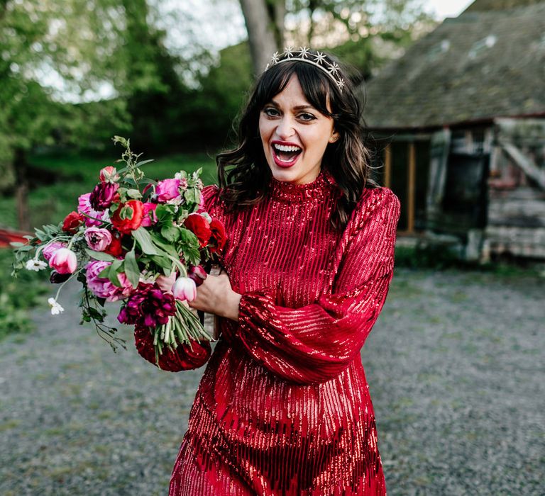 Bride in a short red sparkly wedding dress and red lipstick for a vintage wedding 