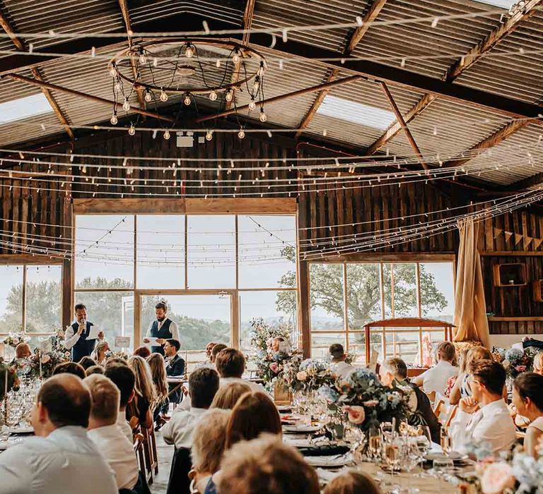 Rustic barn wedding venue with fairy lights