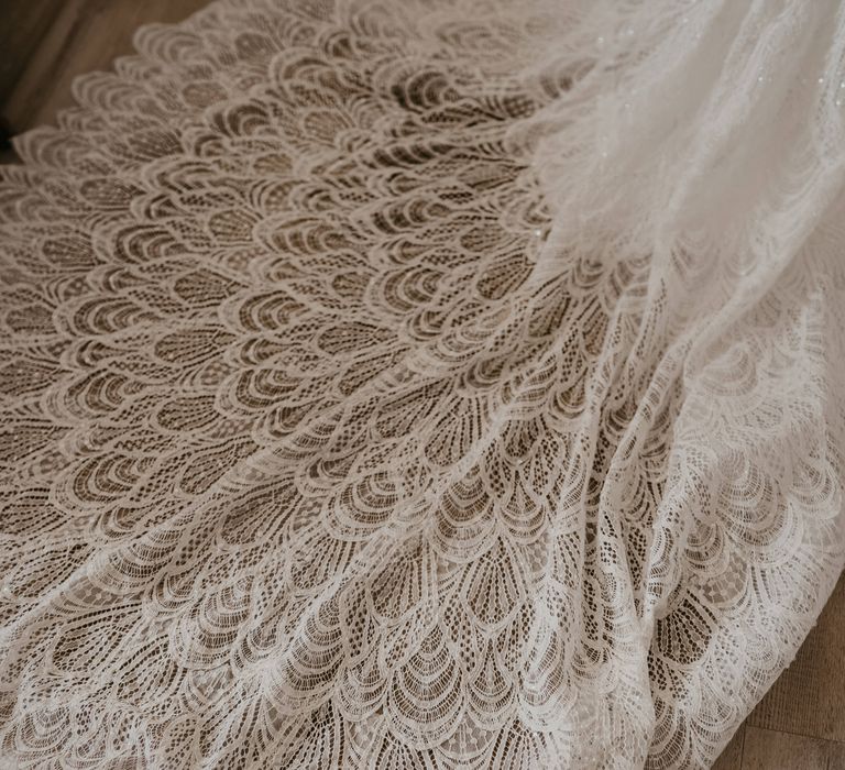 Intricate bridal train featuring lace detailing and sequins throughout | Mark Bamforth Photography