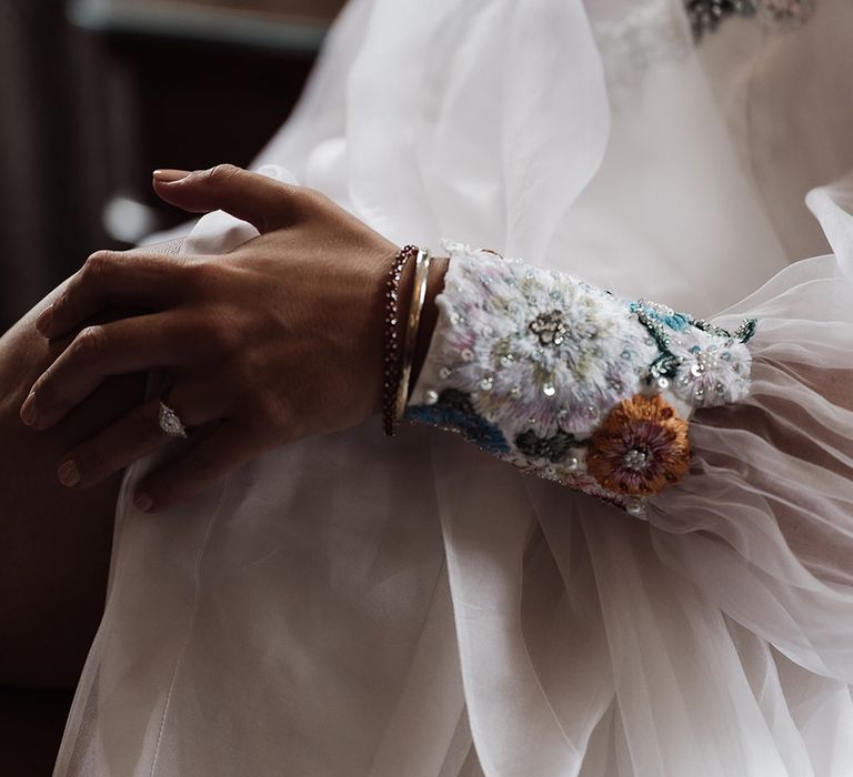 Embroidered floral cuff sleeve of bespoke Victoria Sanders wedding dress