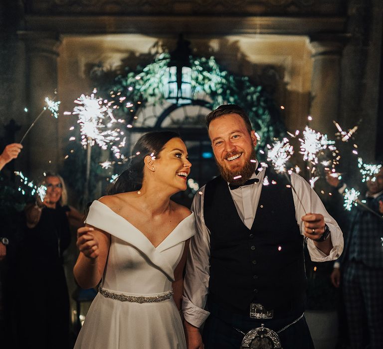 Sparkler exit at Foxhill Manor with the bride in an off the shoulder wedding dress