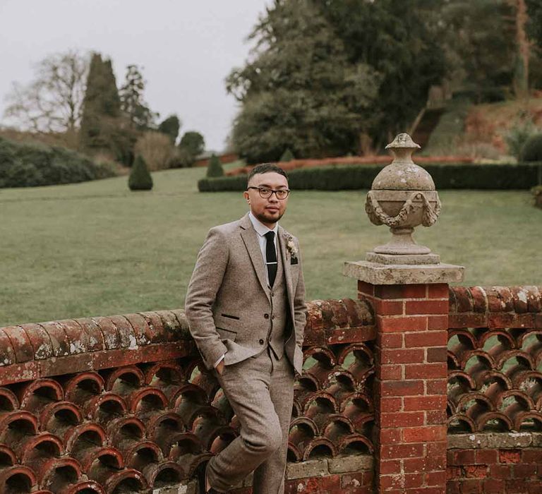 Groom in Tru Clothing suit and GH Bass x Maharishi shoes