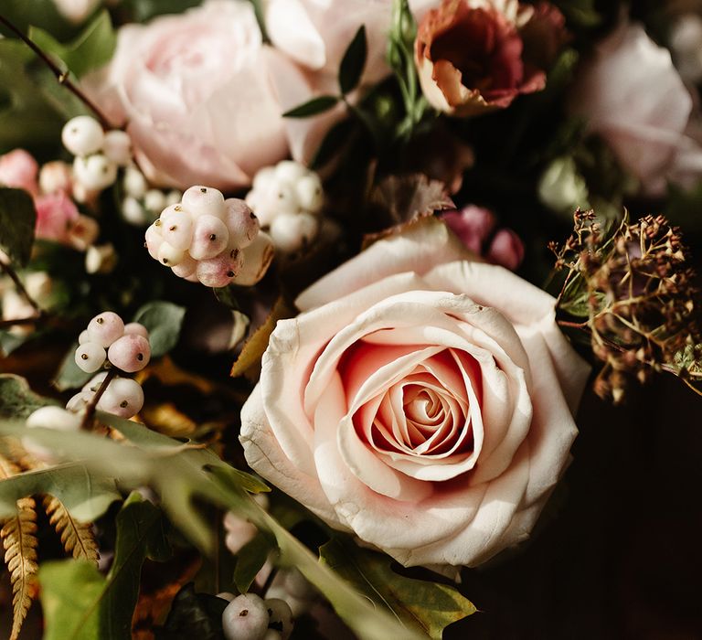 Pink garden roses and other autumnal flowers for wedding bouquet