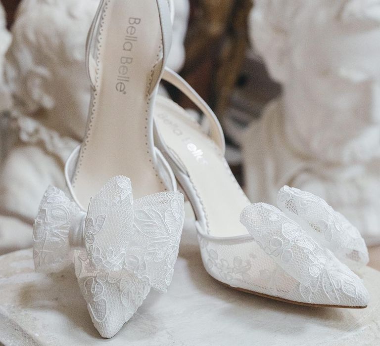 Bella Belle slingback sheer lace wedding shoes with bow and stiletto heel on pedestal