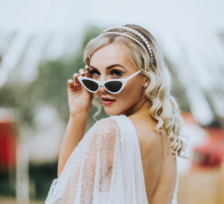 Dreamland Margate wedding inspiration with bride in white retro sunglasses 