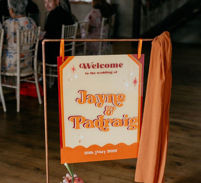 Retro orange, red and yellow welcome wedding sign for 70s style wedding 