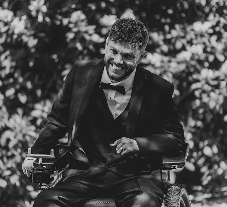 disabled groom in a wheelchair wearing a tuxedo 