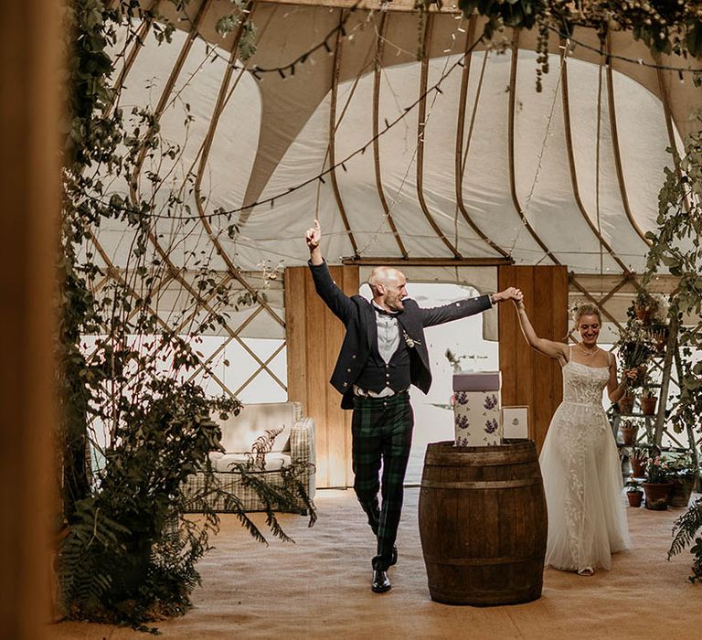 Camp Katur wedding venue with a yurt for the wedding reception decorated with lots of greenery and foliage for enchanted forest vibe 