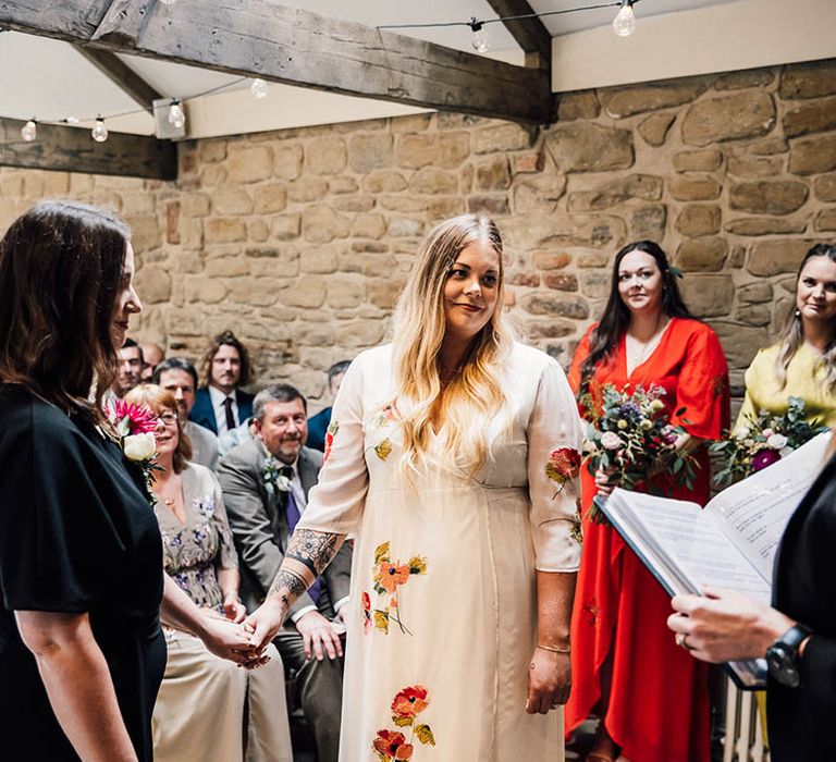 Lesbian wedding with two brides standing facing each other at the The Parlour, Blagdon wedding 