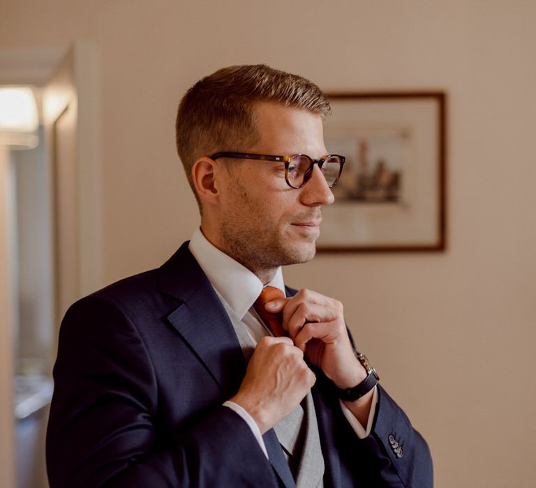 Groom preparations for Larmer Tree Gardens Wedding