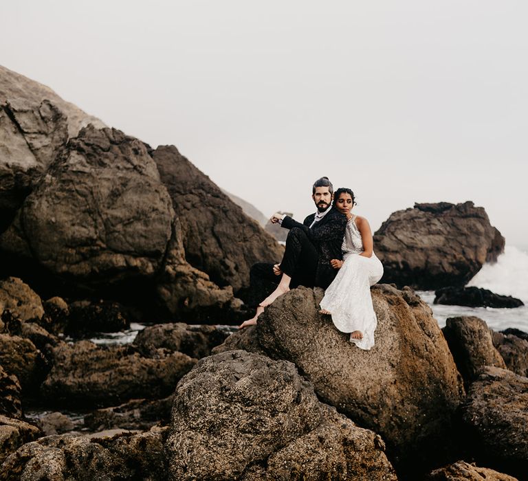 Bride and groom portrait on the rocks at coastal elopement 