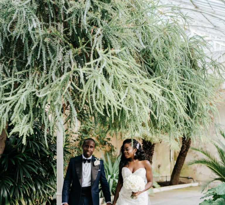 Black bride and groom for botanical glasshouse wedding